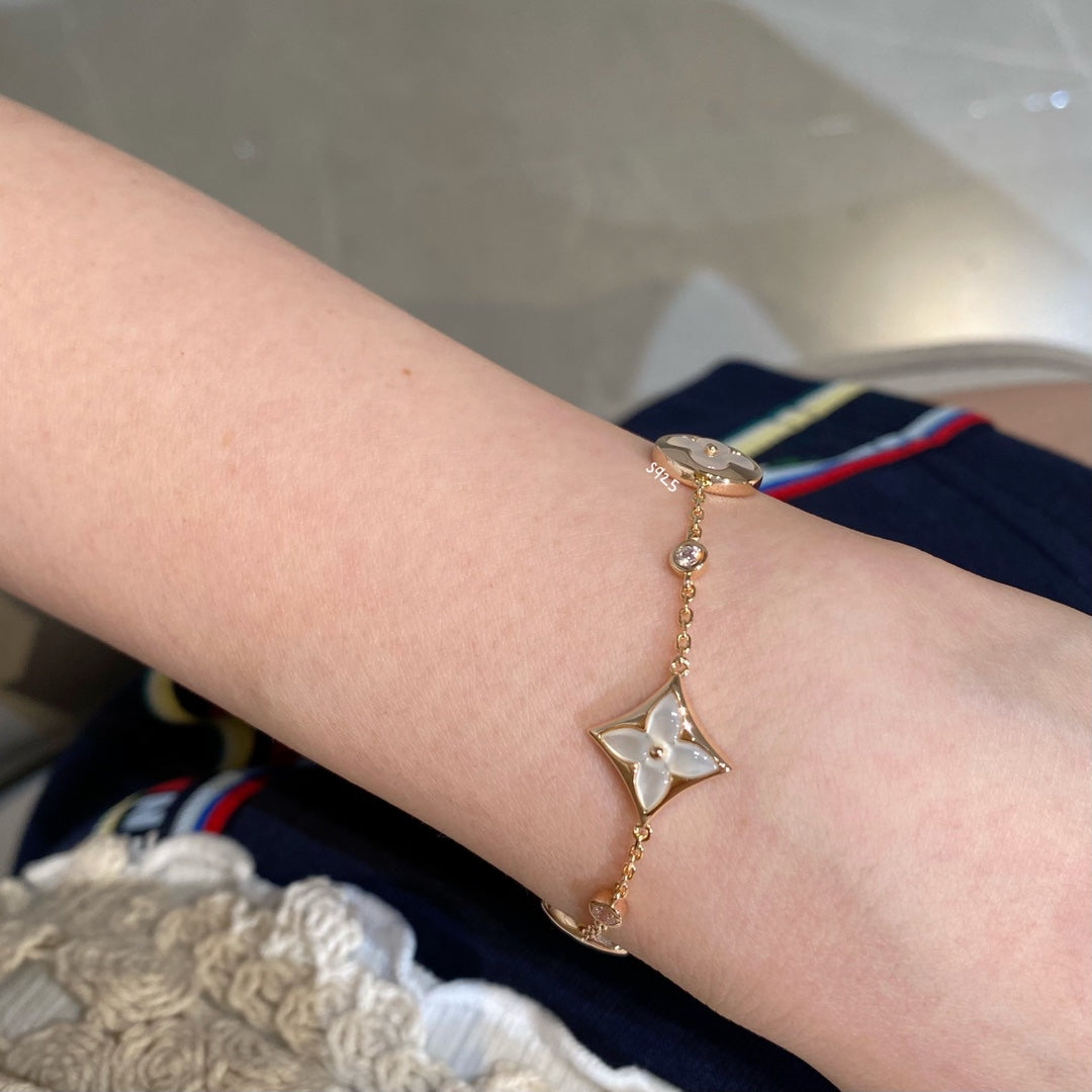 [Elite]STAR AND SUN 4 MOTIF WHITE MOP PINK GOLD BRACELET